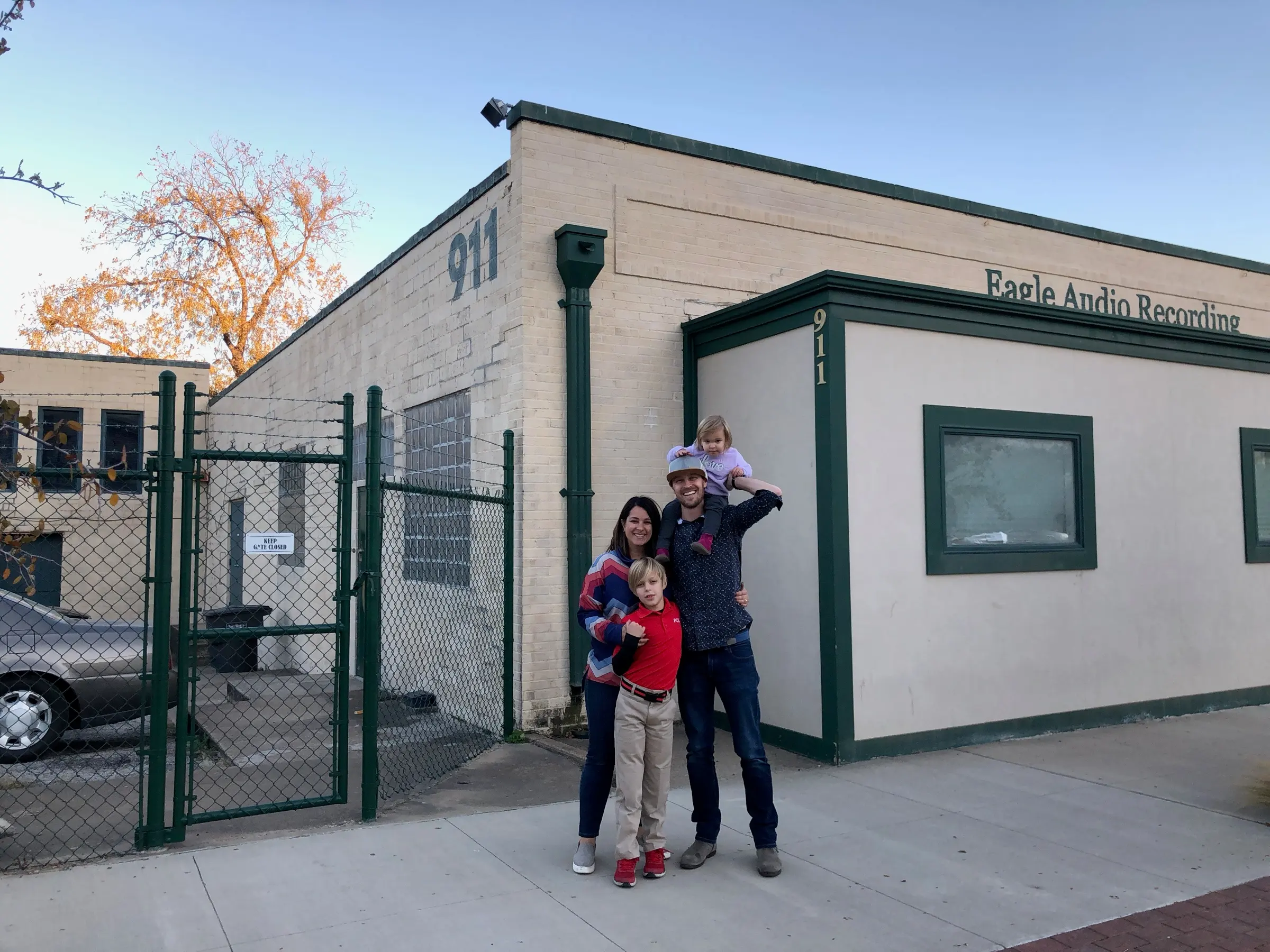 The old Eagle Audio Recording building at 911 S Main, with our whole family out front.